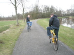 P1011269 Marijn and Pepijn cycling by river.JPG